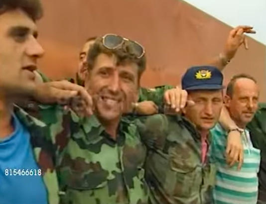 JUNE 12, 1999: Serbian paramilitaries withdraw from Kosovo, singing and promising to return