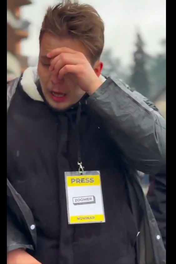 Surreal Scenes From Serbia: Regime Supporters Beat up Journalists, A man is seen drawing a Gun